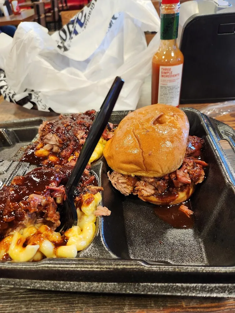 Brisket Sandwich with Mac and Cheese with More Brisket on Top with Spicy BBQ Sauce